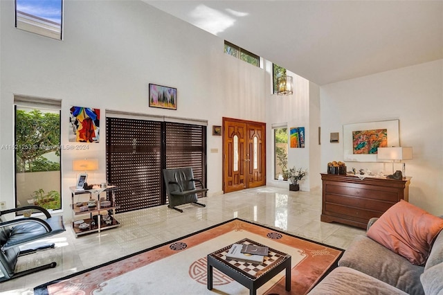 living room featuring a towering ceiling