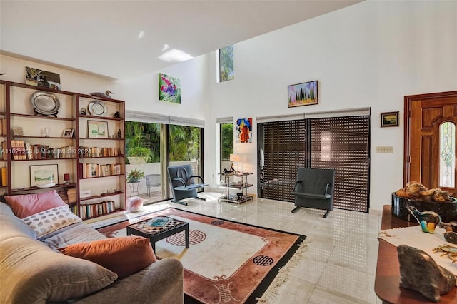 tiled living room with a high ceiling