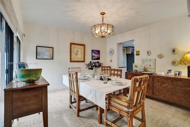 dining area featuring an inviting chandelier