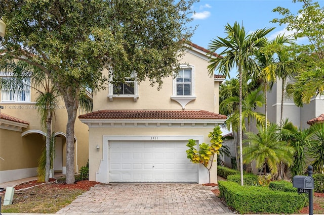 mediterranean / spanish-style home featuring a garage