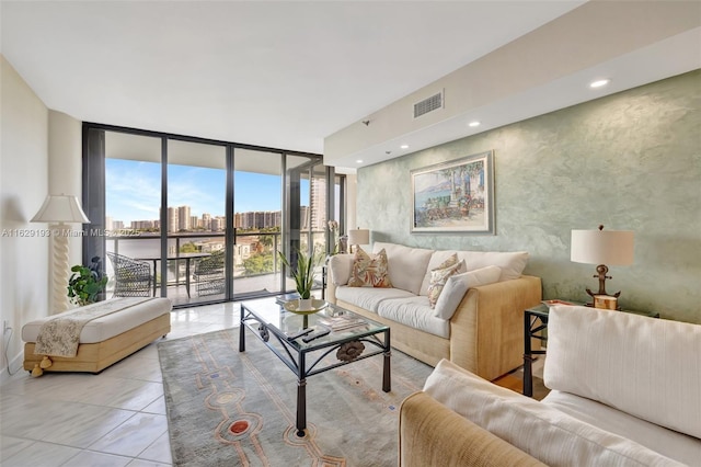 tiled living room featuring expansive windows