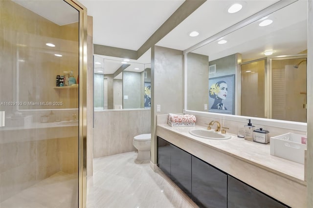 bathroom featuring walk in shower, vanity, and toilet