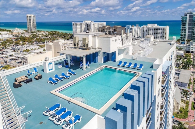 view of pool with a water view