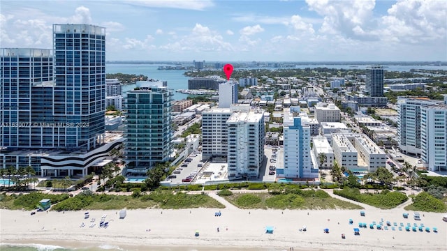 aerial view featuring a water view and a view of the beach