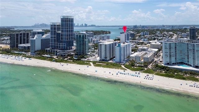 bird's eye view with a beach view and a water view