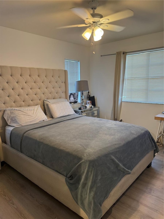 bedroom featuring hardwood / wood-style flooring and ceiling fan