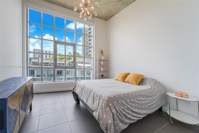 3301 NE 1st Ave Unit M0705, Miami, FL 33137 - tiled bedroom featuring an inviting chandelier
