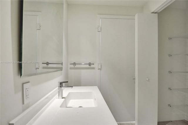 bathroom featuring tile patterned floors and vanity