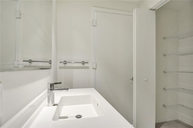 bathroom with vanity and tile patterned flooring