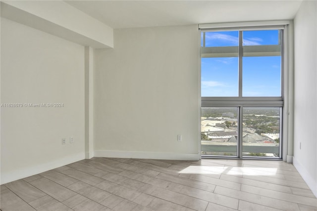 spare room with light hardwood / wood-style floors