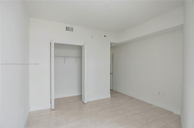 unfurnished bedroom featuring a closet