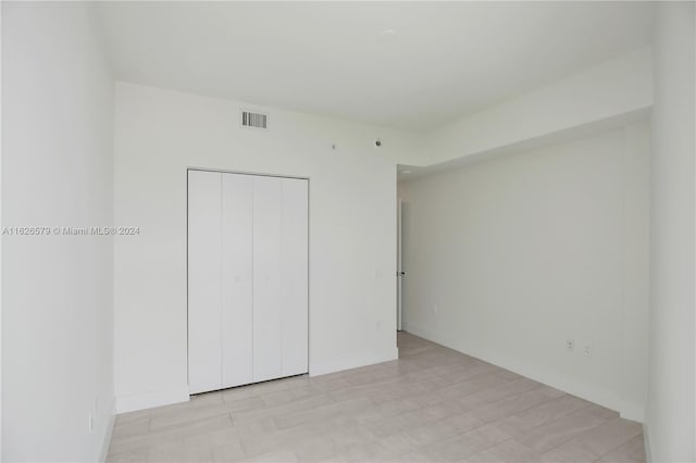 unfurnished bedroom with a closet