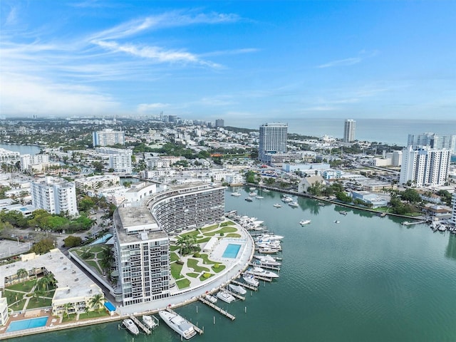 birds eye view of property with a water view