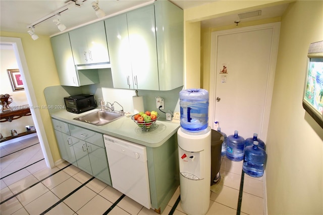 900 Bay Dr Unit 319, Miami Beach, FL 33141 - kitchen featuring white dishwasher, rail lighting, light countertops, light tile patterned floors, and black microwave