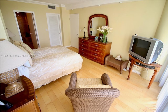 900 Bay Dr Unit 319, Miami Beach, FL 33141 - bedroom featuring wood finished floors and crown molding