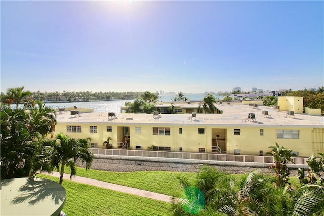 900 Bay Dr Unit 319, Miami Beach, FL 33141 - rear view of property featuring a lawn and a water view