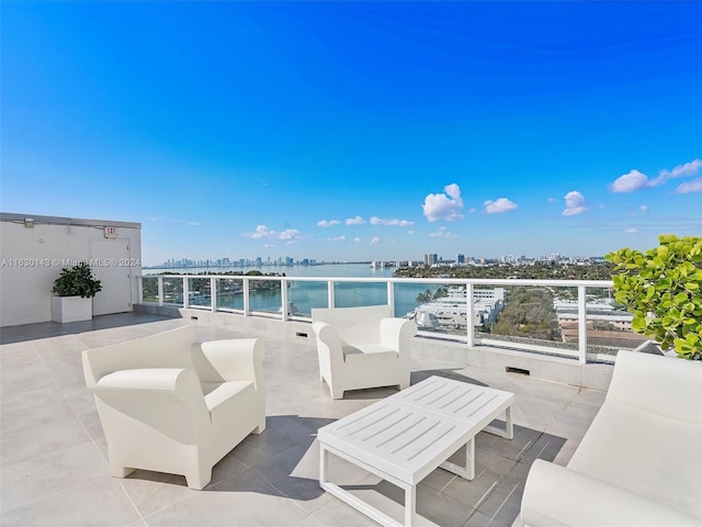 view of patio featuring an outdoor living space and a water view