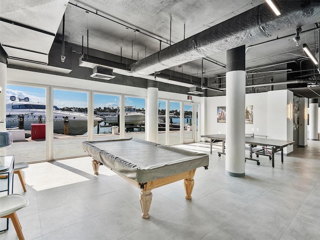 900 Bay Dr Unit 319, Miami Beach, FL 33141 - recreation room featuring a water view, pool table, and a towering ceiling