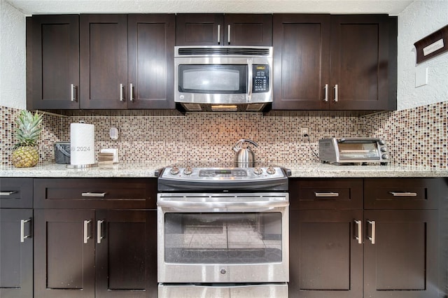 kitchen with backsplash, dark brown cabinetry, and stainless steel appliances