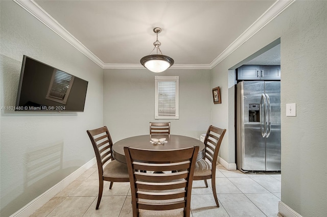 dining area featuring light tile patterned flooring and ornamental molding