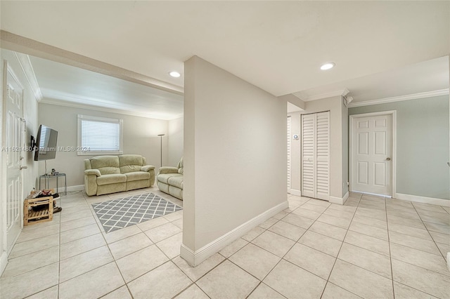 living room featuring light tile patterned floors and crown molding