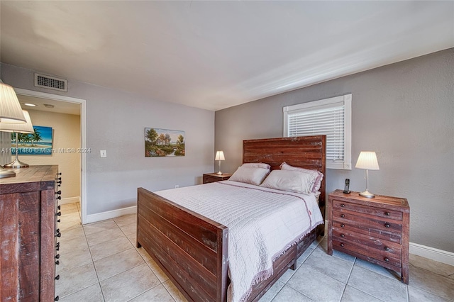 bedroom with light tile patterned flooring