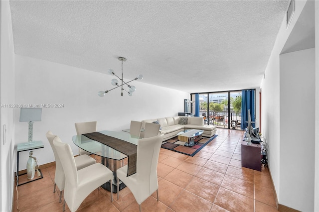 dining room featuring light tile patterned flooring, floor to ceiling windows, a chandelier, and a textured ceiling