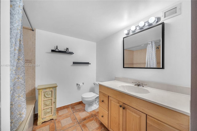 full bathroom with vanity, shower / bath combo, and toilet