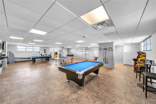 recreation room with a drop ceiling, light tile patterned flooring, and billiards