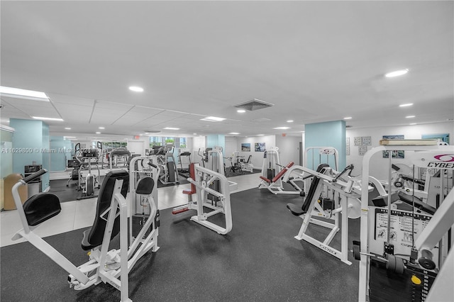 gym featuring a drop ceiling