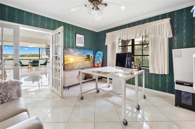 tiled home office featuring ceiling fan, french doors, and crown molding