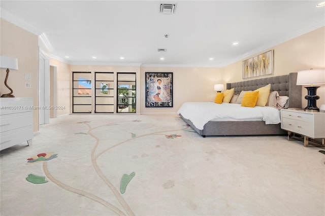 carpeted bedroom with ornamental molding