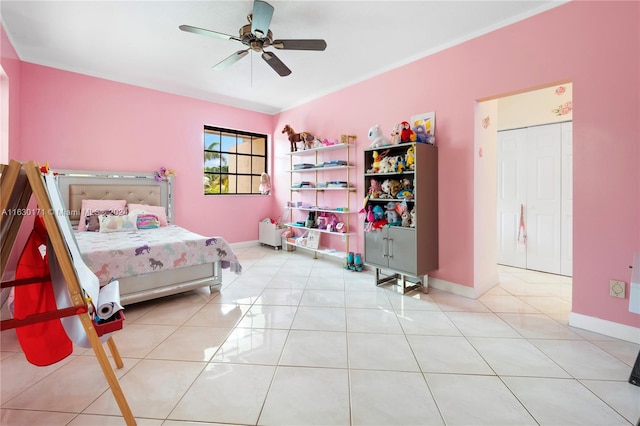 tiled bedroom with ceiling fan