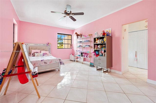 bedroom with ceiling fan and light tile patterned floors