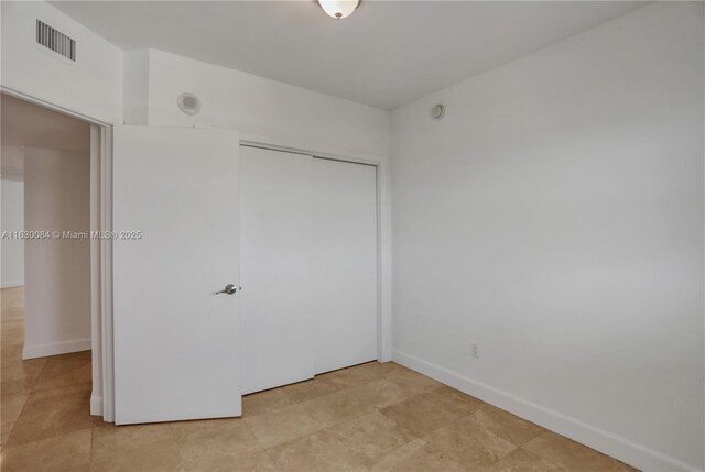 unfurnished bedroom featuring a closet