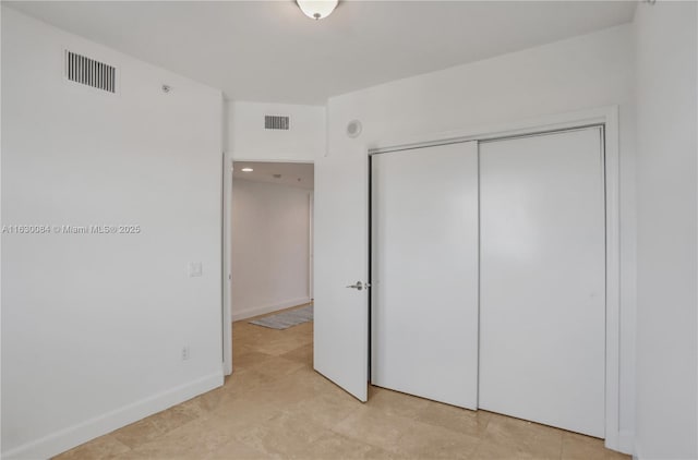 unfurnished bedroom with a closet