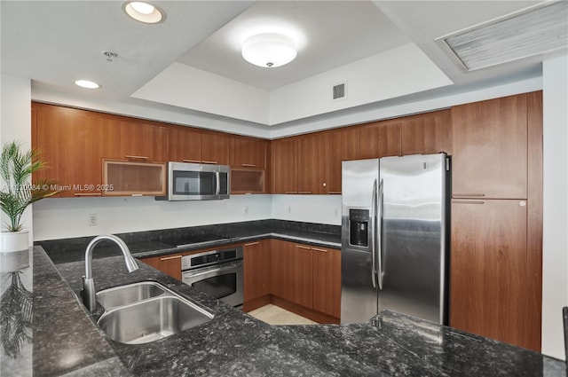 kitchen with sink, kitchen peninsula, and stainless steel appliances