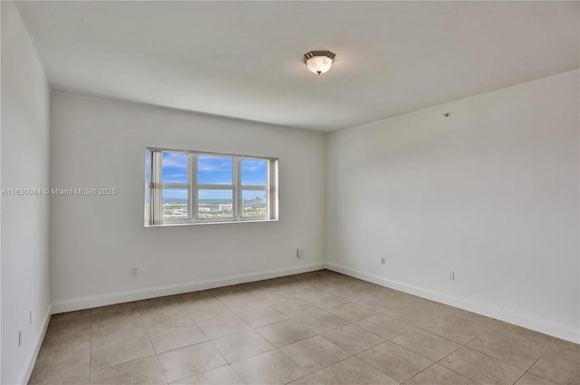 unfurnished room with light tile patterned floors