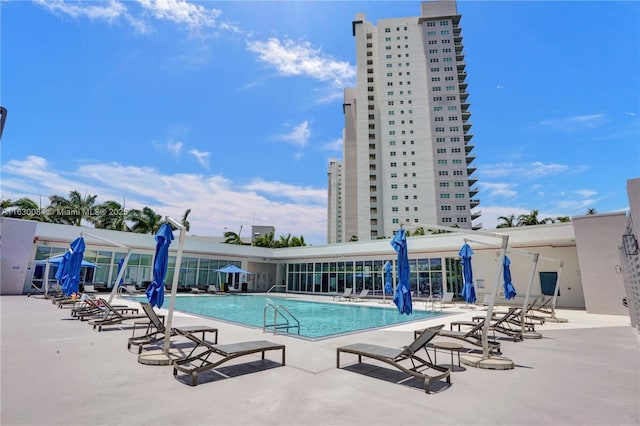 view of swimming pool featuring a patio