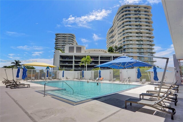 view of swimming pool with a patio area