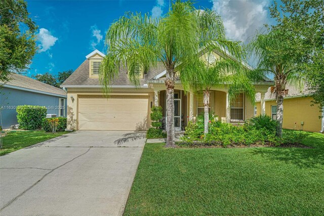 view of front of house with a garage and a front yard