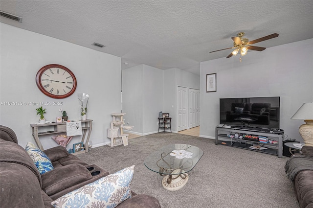 504 Sebastian Crossings, Sebastian, FL 32958 - living room featuring ceiling fan, carpet flooring, and a textured ceiling