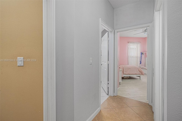 hallway featuring light tile patterned floors