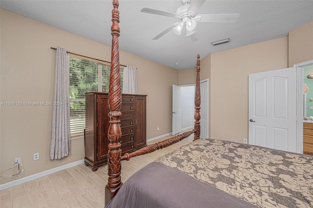 bedroom featuring ceiling fan, a textured ceiling, and light hardwood / wood-style flooring