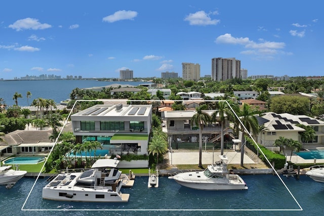 birds eye view of property with a water view