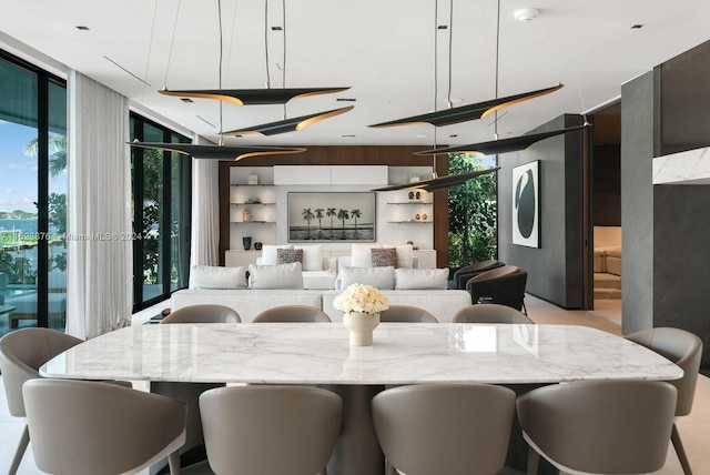 dining room featuring a wall of windows