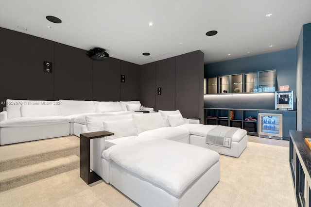 home theater room with light colored carpet