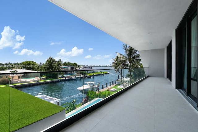 balcony featuring a water view