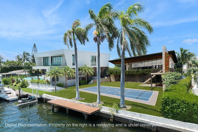 exterior space featuring a water view and a lawn