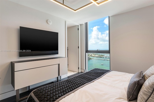 bedroom featuring a wall of windows